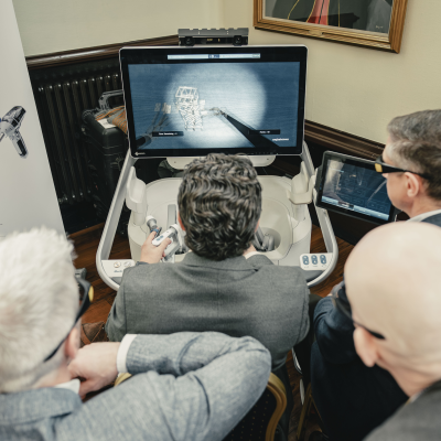 Someone practising with a surgical robot